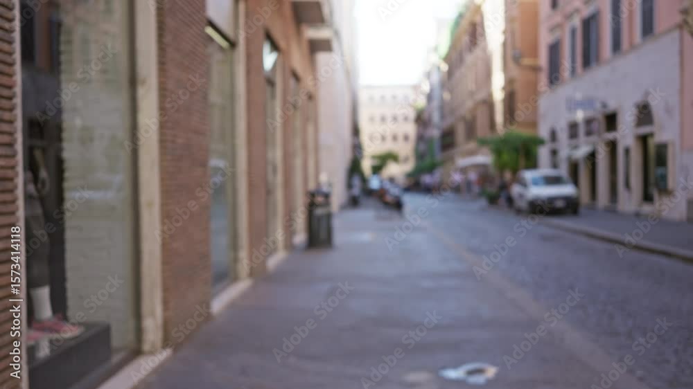 Blurred urban street in rome with bokeh effect on historic architecture and defocused pedestrians conveying a busy city atmosphere in an iconic italian setting. Blurred urban street in rome with bokeh effect on historic architecture and defocused pedestrians conveying a busy city atmosphere in an iconic italian setting.