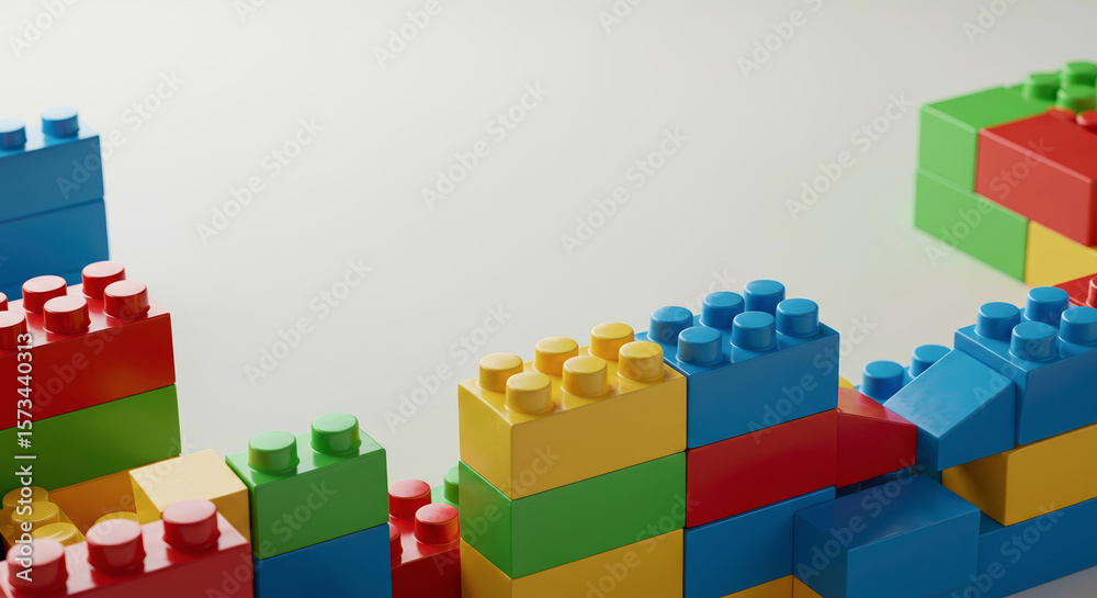 Fototapeta premium Colorful building blocks arranged creatively on a light background 