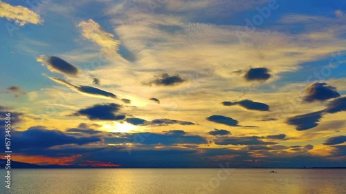 Orange and Golden Glitter Sunset Sky Calm Tranquil Sea Footage.
