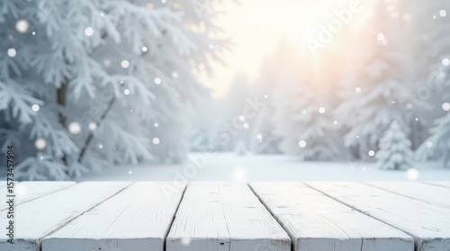 Winter snowy background with frosted white wooden table and falling snowflakes, festive seasonal backdrop