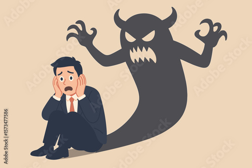 Concept of fear, anxiety, and inner demons. Businessman scared of his own monster shadow. Metaphor for panic attack, depression, phobia, paranoia, and mental health issues.