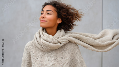 Elegant wool scarf in motion with woman outdoors in autumn breeze