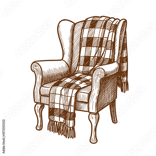 Wooden armchair with plaid blanket draped over in cozy autumn style  