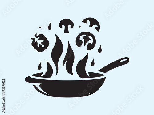 Artistic frying pan with vegetables and dramatic fire burst
