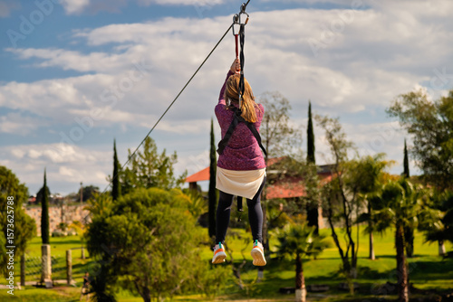 Woman riding a zip line at the park of the Prismas Basalticos in Huasca de Ocampo, Mexico