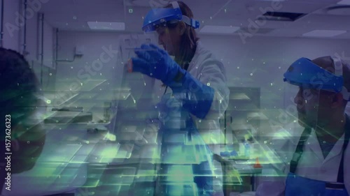 Lead scientist lifting tray and scanning transparent sheet for inspection in lab with data overlay