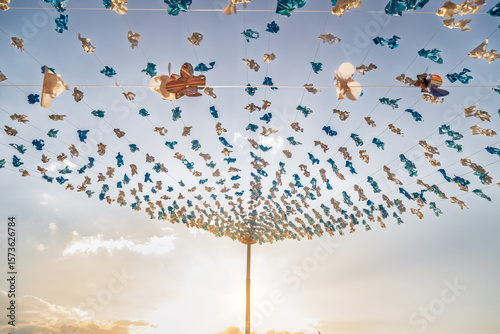 Blue and white plastic decorations with sunset backlight