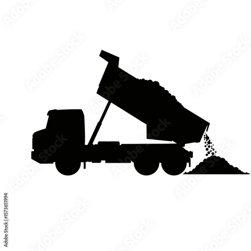 Silhouette of a dump truck unloading a load of material.