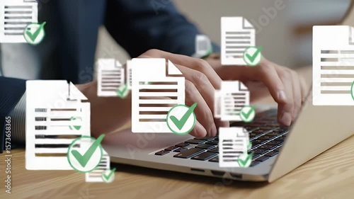 Close Up of Hands Typing on Laptop Keyboard with Document Icons on Wooden Desk in Natural Lighting Business Concept