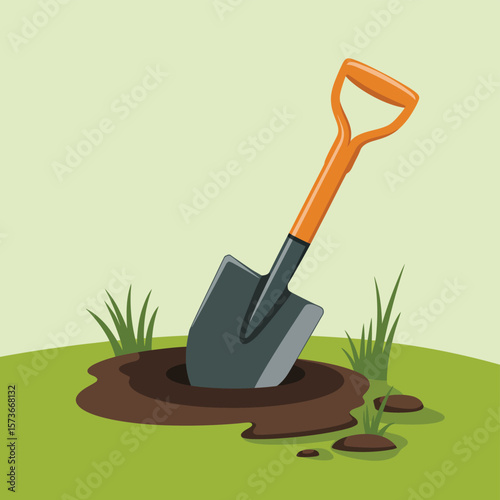 Gardening shovel stuck in freshly dug hole on green grass