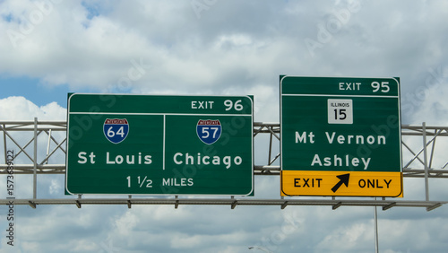 Road travel banner. Highway signs for exits on Interstate 64 in Illinois for St Louis and Chicago. Journey concept design element.