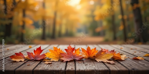 Colorful Autumn Leaves on Wooden Table with Blurred Forest Background