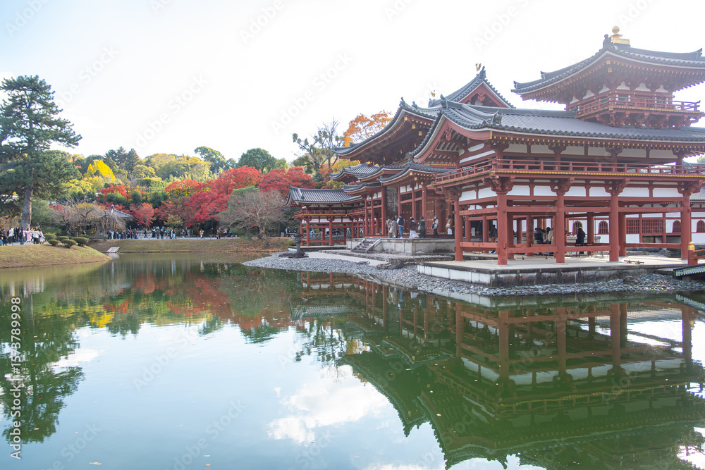 Byodo-in Temple Uji Kyoto Japan, Serene temple reflection on a tranquil pond in autumn scenery. Byodo-in Temple Uji Kyoto Japan, Serene temple reflection on a tranquil pond in autumn scenery.