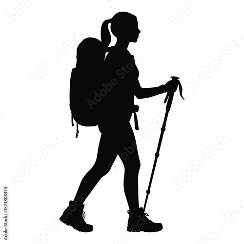 Woman hiker with backpack and trekking pole walking silhouette