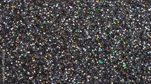 Shiny luxury black glitter texture surface background stop motion