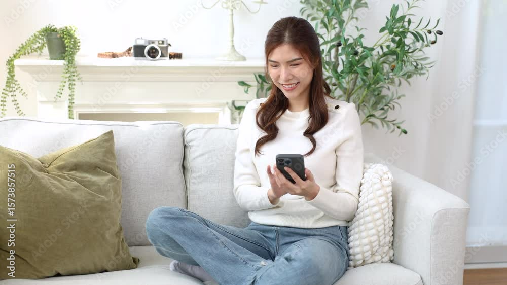 Asian working woman using smartphone for digital interaction, voice communication, modern beauty influencer lifestyle, online freelancer talking AI chatbot, mobile technology, friendly cozy mood Asian working woman using smartphone for digital interaction, voice communication, modern beauty influencer lifestyle, online freelancer talking AI chatbot, mobile technology, friendly cozy mood