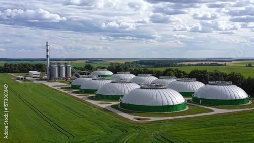 Aerial view of biogas plant for renewable energy generation on a sunny day with cloudy sky landscape