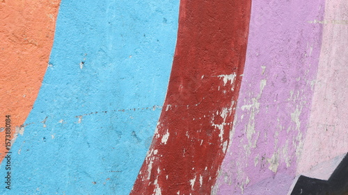 Colorful concrete wall texture background in bright color painting.