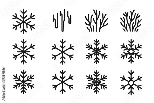 Elegant black snowflake and icicle silhouettes on dark background