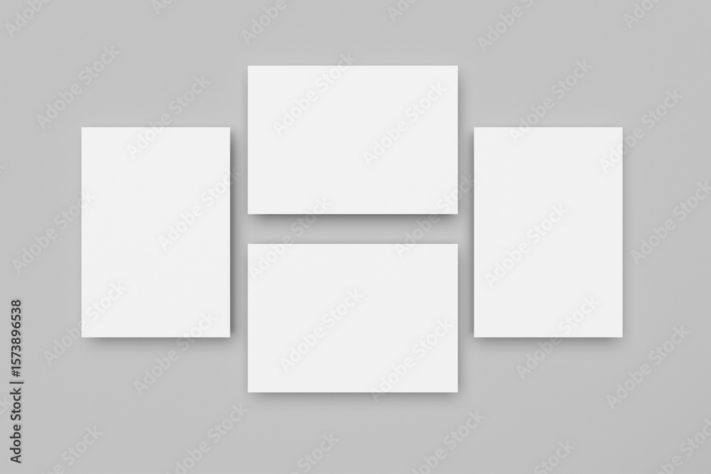 Fototapeta premium White A4 paper, magazine, or business card mockups floating diagonally with soft shadows isolated on grey background.