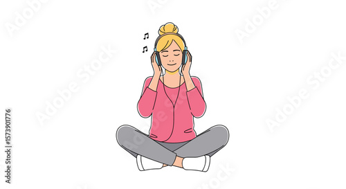 Young woman enjoying music through headphones while sitting in a relaxed pose