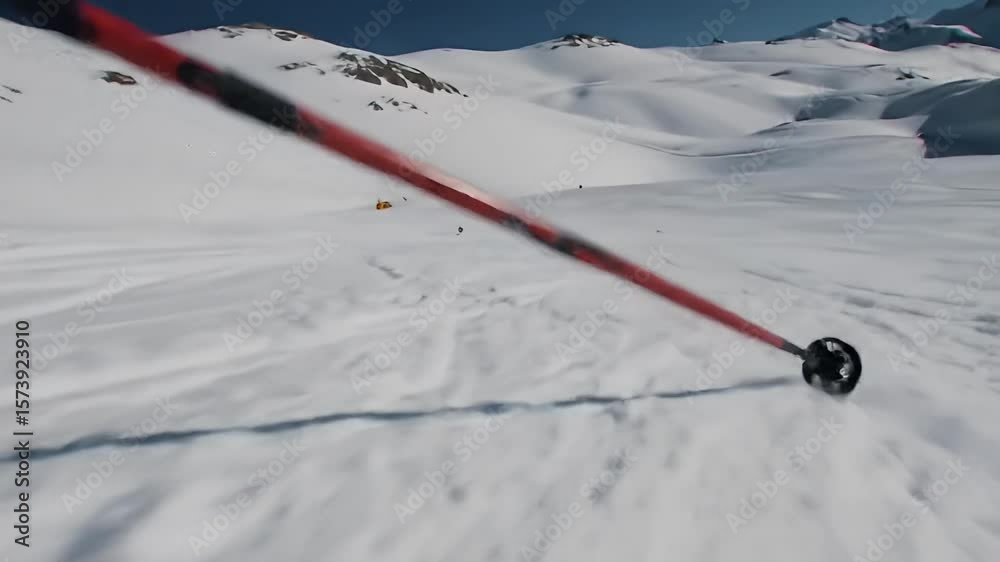 Snowy mountain range with ski tracks and a small structure Snowy mountain range with ski tracks and a small structure