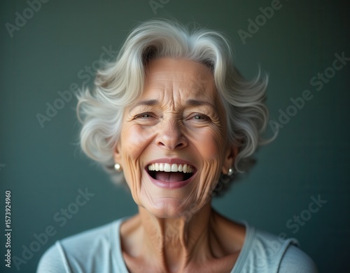 Beautiful gorgeous 50s mid age beautiful elderly senior model woman with grey hair laughing and smiling Mature old lady close up portrait Healthy face skin care beauty skincare cosmetics dental 