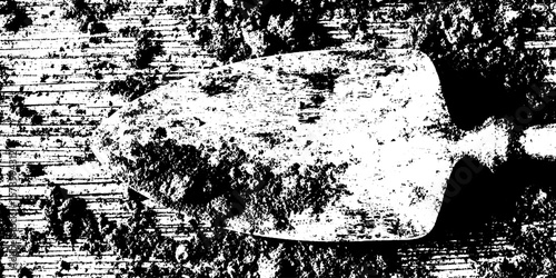 Rustic shovel in textured soil with clods for gardening and farming design