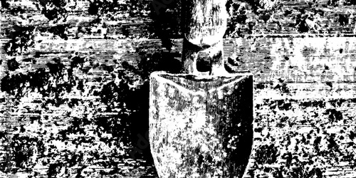 Rustic shovel on distressed soil background for gardening and farming themes