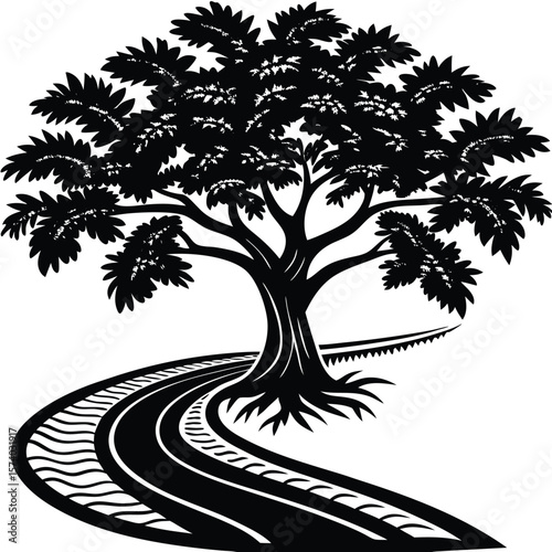 Majestic tree silhouette embracing a winding road path