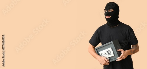 Male thief with stolen safe...