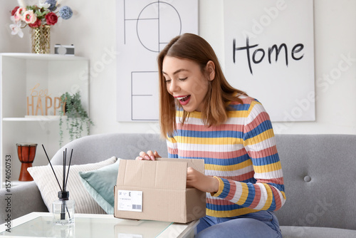Happy young woman opening p...