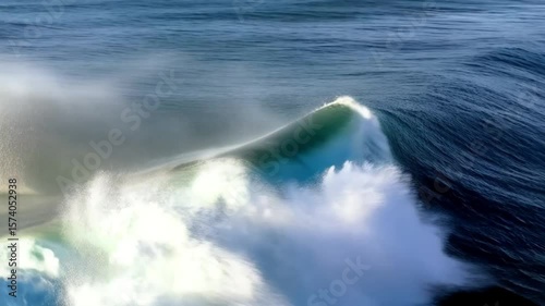 Massive ocean wave crashing under sunlight – powerful surf video
