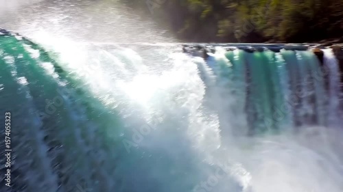 Powerful waterfall crashing into misty basin – dynamic nature video