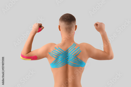 Young man with physio tape ...