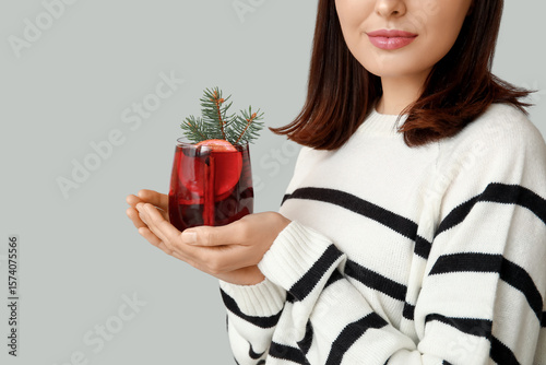 Young woman with glass of h...
