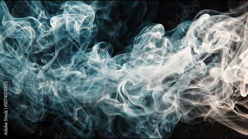 wispy patterns of light smoke dancing across a black background