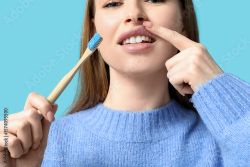 Young woman with toothbrush...