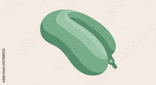 A green travel pillow, designed for neck support, resting on a neutral background.