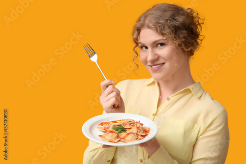 Happy young woman with fork...