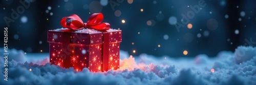 Luminous gift box in snow, red bow, falling snow, night , night, glowing, bright