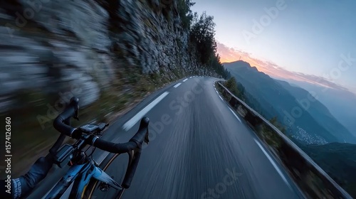 Cycling adventure at dusk mountain road action photography scenic landscape dynamic perspective outdoor experience