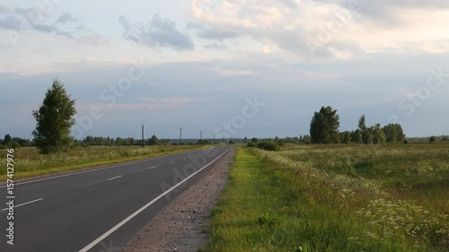 Asphalt road in the countryside. Summer landscape with empty road