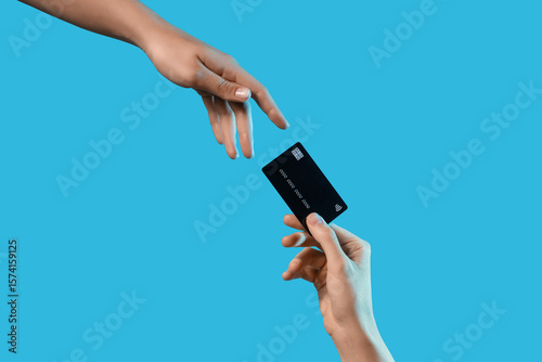 Hands with credit card on b...