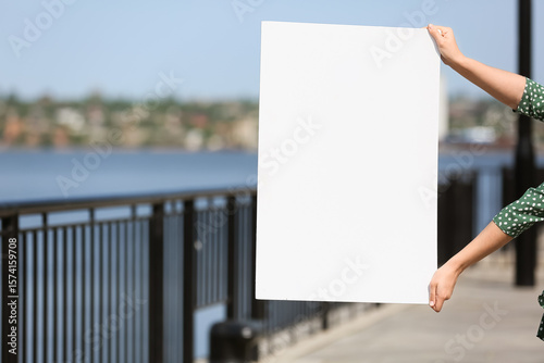 Female hands holding blank ...