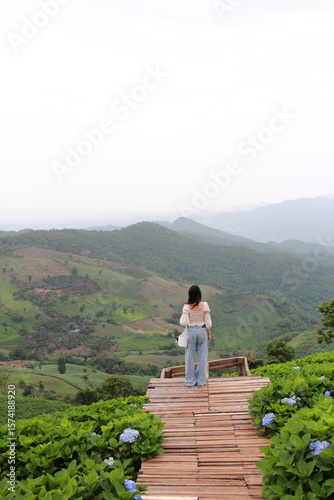 young woman walking in the mountains