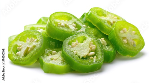 Sliced jalapeños gleam vibrant green against white