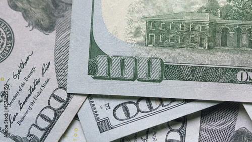A CloseUp View of Stacked US Dollar Bills Displaying Their Intricate Details and Design