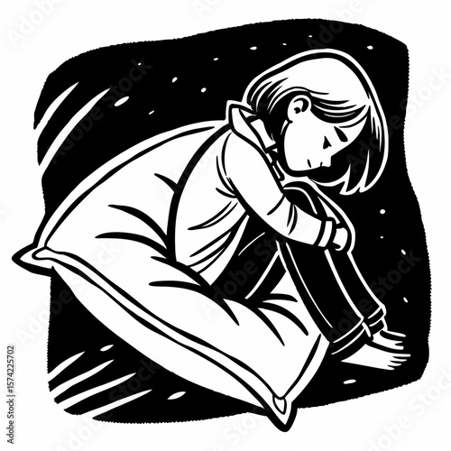 Child hugging knees on a pillow sitting