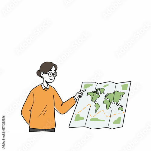 Young man pointing at world map while studying travel routes  